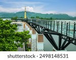 Kanchanaburi, Thailand Skywalk bridge stretching parallel to banks of Khwae Yai or Si Sawat river for thai people foreign travelers travel visit and walking on clear glass bridge