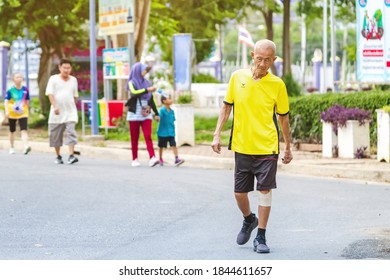 KANCHANABURI, THAILAND-AUGUST 20,2020 : Unidentified Asian elderly man in fitness wear walking and jogging for good health at public park in Tha Muang district Kanchanaburi ,Thailand. - Shutterstock ID 1844611657