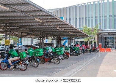 KANCHANABURI, THAILAND-AUGUST 22,2021 : Group Of Food Delivery Service Riders Park Motorbike To Relax And Wait To Get Food From The Restaurant At Parking Lot In Front Of Robinson Department Store.