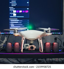 Kandalaksha, Russia - May 20, 2022: DJI Phantom 4 Pro V2.0 Quadcopter Drone with Batteries on the Computer Table