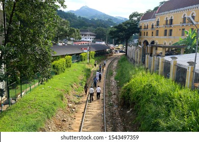 Kandy, Sri Lanka - 12 April 2019: Sri Lankan Kids Walking On The Rails.