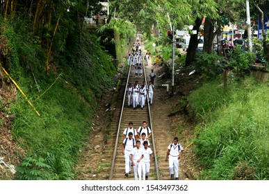 Kandy, Sri Lanka - 12 April 2019: Sri Lankan Kids Walking On The Rails.