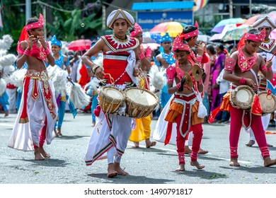 KANDY, SRI LANKA - AUGUST 15, 2019 : Thammattam Players, A Cymbal Player And A Fute Player Perform During The Esala Day Perahera.