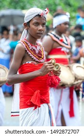 KANDY, SRI LANKA - AUGUST 15, 2019 : A Cymbal Player Performs Along A Road During The Buddhist Day Perahera (procession).