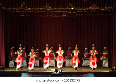 KANDY, SRI LANKA - MARCH 30: Sri Lankan dancers in traditional costumes perform for tourists in Kandyan Cultural Centre on March 30, 2012 in Kandy, Sri Lanka