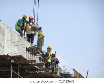 KANGAR, MALAYSIA -JULY 31, 2017: Construction Workers Working At Height Without Wearing Proper Safety Gear Like Body Harness. This Dangerous Act Can Cause Accidents And Death.