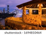 Kangaroo point cliffs rotunda at night from the cliffs boardwalk with purple smooth sky and view of Brisbane city