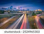 Kansas City, Missouri, USA. Cityscape image of Kansas City skyline with busy highway leading to the city at autumn sunrise.