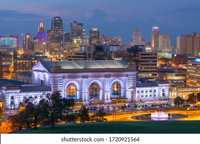 Kansas City, Missouri, USA downtown skyline with Union Station at dusk.