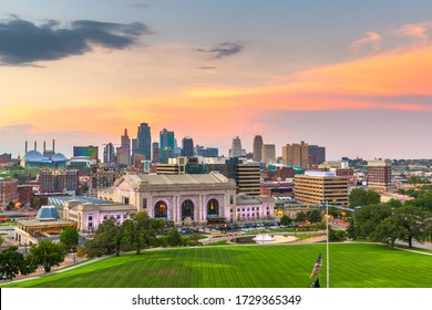 Kansas City, Missouri, USA downtown skyline with Union Station at dusk.