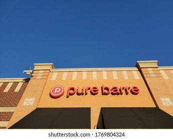 Kansas City, Missouri / USA - June 13 2020: Sign For Pure Barre Beneath Blue Sky