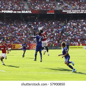 KANSAS CITY, MO- JULY 25: Kansas City Wizards Take On English Powerhouse Manchester United On July 25, 2010 In Kansas City MO. Mame Biram Diouf (#32) Beats Shavar Thomas For A Header.