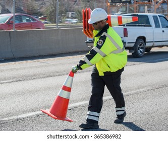 Kansas City, MO - March 26, 2015: Emergency Worker Places Cones