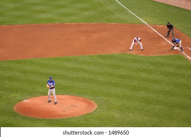A Kansas City Royals pitcher watching the player at first base