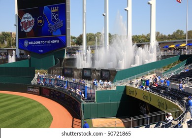KANSAS CITY - SEPTEMBER 27: Royals fans watch a baseball game near the signature crown scoreboard and fountains of Kauffman Stadium on September 27, 2009 in Kansas City, Missouri.