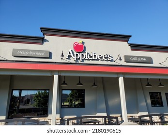 Kansas City, Kansas, USA - July 19, 2022: Sign For Applebee's Neighborhood Grill And Bar Beneath Blue Sky