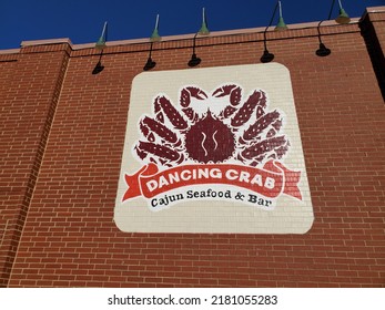 Kansas City, Kansas, USA - July 19, 2022: Sign On Restaurant Wall For DANCING CRAB Cajun Seafood And Bar