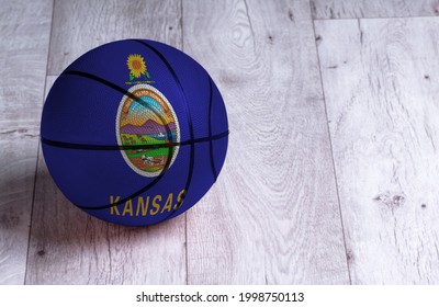 Kansas Flag Is Featured On A Basketball. Basketball Championship Concept.