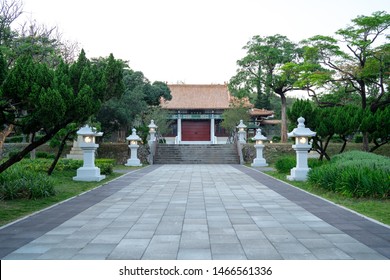 Kaohsiung, Taiwan - 17 April 2019: Path Leading To The Entrance Of The Martyrs Shrine Memorial Building With Green Trees On Both Sides And Traditional Chinese Garden Lamps