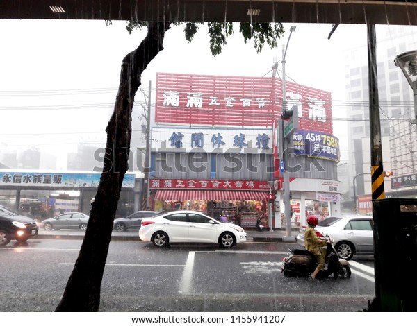 Kaohsiung, Taiwan. July\
19, 2019: During the heavy rain, the locomotive was flooded on the\
road. Taiwan flood