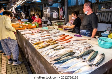 Kaohsiung, Taiwan - May 12, 2021: A stall selling fish at the traditional market in Kaohsiung, Taiwan. This is a large traditional market in North Kaohsiung, Taiwan