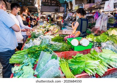 Kaohsiung, Taiwan - May 12, 2021: A stall selling vegetables at the traditional market in Kaohsiung, Taiwan. This is a large traditional market in North Kaohsiung, Taiwan