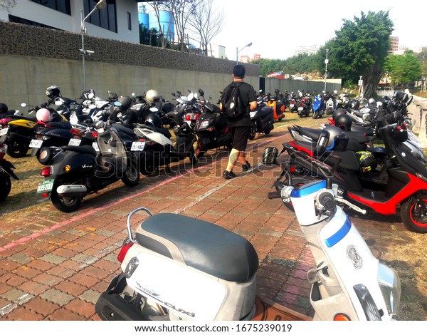 Kaohsiung,\
Taiwan-March 9, 2020:A group of motorcycles and scooters were\
parked together in the parking\
lot.