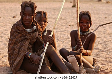 KAOKOVELD, NAMIBIA - OCT 13, 2016: Unidentified group of Himba girls. Their hairs are traditionally braided and characterize them as girl. The himbas are a traditional tribe in Africa.  