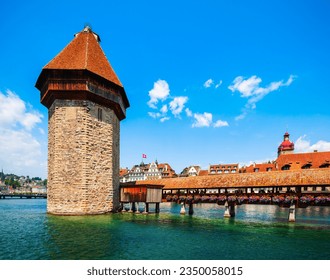 Kapellbrucke or Chapel Bridge is a wooden footbridge spanning Reuss river and Wasserturm water tower in Lucerne city, central Switzerland