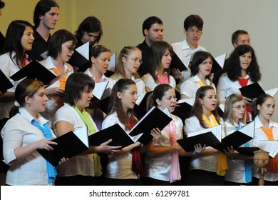 KAPOSVAR, HUNGARY - AUGUST 26: Members of the Liszt Ferenc Music School Choir sing at the IV. Pannonia Cantat Youth Choir Festival August 26, 2010 in Kaposvar, Hungary