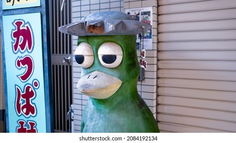 Kappabashi, Tokyo, Japan - November 27 2021: A statue of "Kappa" a mythical water imp and the official mascot of Kappabashi. Kappabashi is a street with shops dedicated to the restaurant industry. 