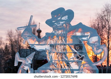 Karabas-Barabas. Ice Sculpture-evil Puppeteer Controls A Puppet On The Background Of A Religious Temple. Concept: Religion Is Control Of People, Manipulation Of Believers.