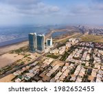 karachi pakistan 2021, cityscape and landmarks of karachi city, aerial picture of bahria icon tower, dolmen mall clifton, harbor front. Sunrise at karachi, sea view, Business hub of Pakistan
