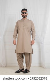 Karachi, Pakistan - April 08, 2021: Young Pakistani Men wearing shalwar Kameez (kurta). Fashion Concept