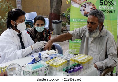 KARACHI, PAKISTAN - AUG 21: Journalists Are Being Examining By Doctors During Free 
Medical Camp Facility Organized By Advanced Lab Laboratory Held At Press Club On August 21, 2021 In Karachi.