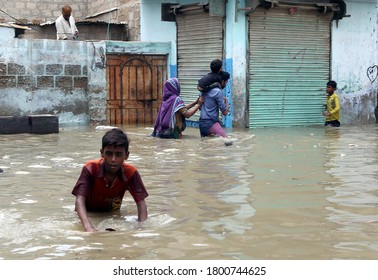 KARACHI, PAKISTAN - AUG 22: Residents are facing difficulties due to flooded area caused by heavy downpour of monsoon season due to poor sewerage system, on August 22, 2020 in Karachi.
