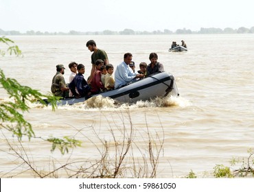KARACHI, PAKISTAN, AUG 26: Navy (PN) rescue team shift flood affected people towards safe place on boat during rescue operation at a flood affected area on August 26, 2010 in Karachi, Pakistan