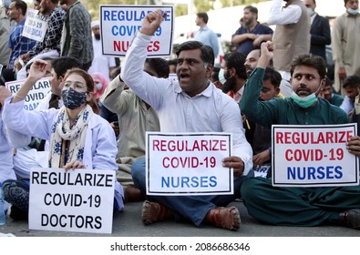 KARACHI, PAKISTAN - DEC 06: Members Of Young Nurses Association Are Holding Protest Demonstration For Regularize Covid-19 Doctors And Nurses Nearby CM House On December 06, 2021 In Karachi. 