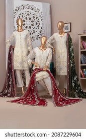 Karachi, Pakistan - December 05, 2021: Mannequin dressed in Pakistani fashion salwar kameez designer dress in display. Fashion Concept