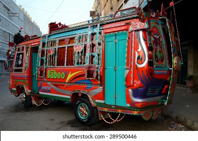 Karachi, Pakistan - February 22, 2015: An ornately painted passenger minibus on a street in Saddar. Bus / truck drivers decorate vehicles using artists in a genre now called truck art. 