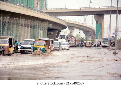 KARACHI, PAKISTAN - JUL 06: Stagnant rainwater after downpour of monsoon 
due to poor sewerage system, creating problems for residents, showing negligence of 
authorities, on July 06, 2022 in Karachi.