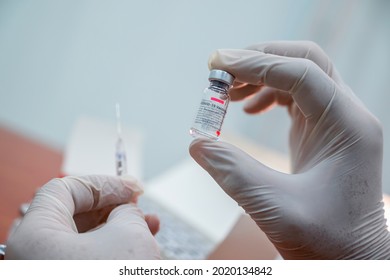 Karachi, Pakistan - July 10, 2021: Sinopharm COVID-19 vaccine bottle dose , Sars-Cov-2 Vaccine inactivated Vero cell, Sino pharm is a Chinese state-owned company, Selective focus