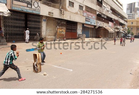 Karachi Pakistan Jun 04 Children Are Playing Cricket On Vacant Road During The Karachi Pakistan Jun 04 Children Are Playing Cricket On Vacant Road During The