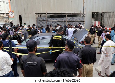 KARACHI, PAKISTAN - JUN 29: Members Of Police Crime Scene Unit Investigate Around A Car Used By Alleged Gunmen At The Main Entrance Of The Pakistan Stock Exchange Building On June 29, 2020 In Karachi.