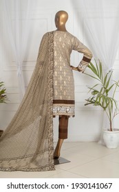 Karachi, Pakistan - March 05, 2021: Mannequin dressed in Pakistani fashion salwar kameez in display. Fashion Concept