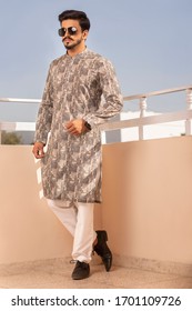 Karachi, Pakistan - March 15, 2020: Young Men Wearing Shalwar Qameez (kurta) Standing In Balcony. Fashion Concept