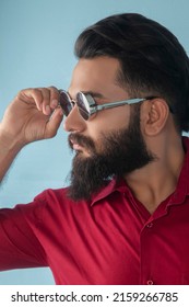 Karachi, Pakistan: May 22, 2022: Young Pakistani Man Wearing Red Shirt And Blue Jeans Designer Dress. Posing In Studio. Fashion Concept