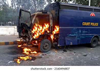 KARACHI, PAKISTAN - MAY 25: View of venue after ablaze police van during clash between police staffs and protesters of PTI during protest demonstration (Azadi Long March) on May 25, 2022 in Karachi.