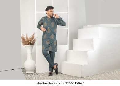 Karachi, Pakistan - Mmay 14, 2022: Pakistani Man In Traditional Wear  Kurta Pyjama Cloths. Male Fashion Model In Sherwani, Posing In Studio, Wedding Fashion Concept