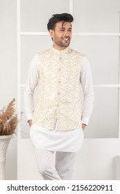 Karachi, Pakistan - Mmay 14, 2022: Pakistani Man In Traditional Wear  Kurta Pyjama Cloths. Male Fashion Model In Sherwani, Posing In Studio, Wedding Fashion Concept